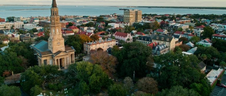 Aerial View Over Rooftops of Charleston, South Carolina at Sunset