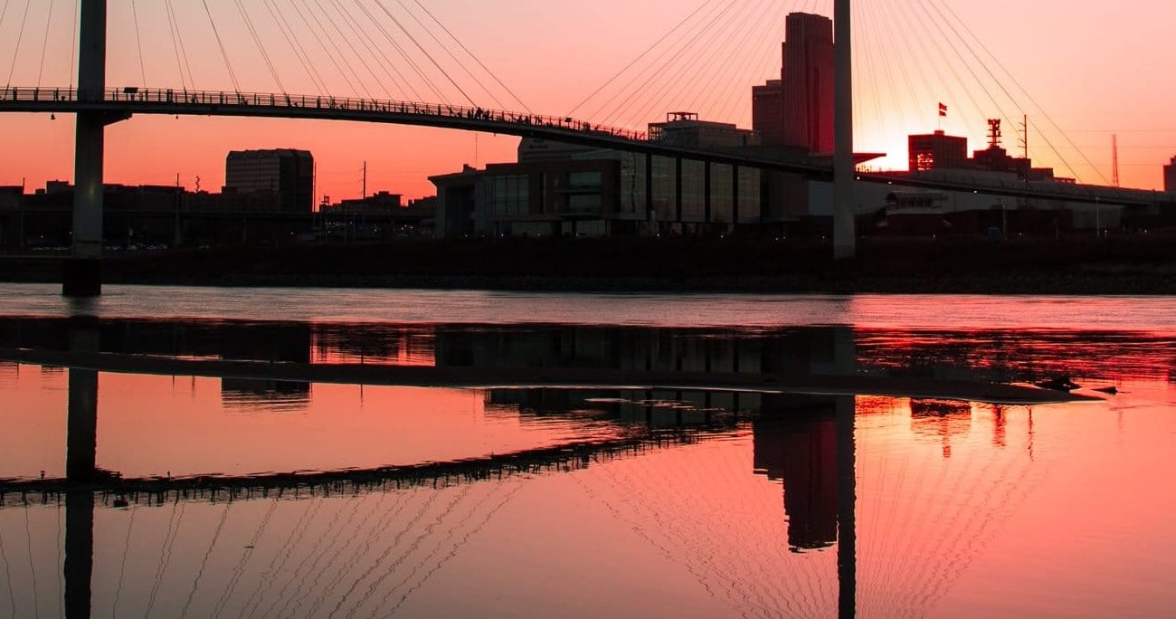 The Bob Kerrey Pedestrian Bridge and Omaha skyline at sunset