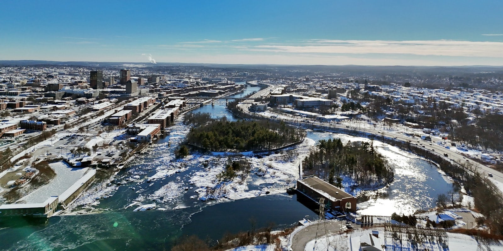 Manchester NH skyline over the Merrimack, winter aerial