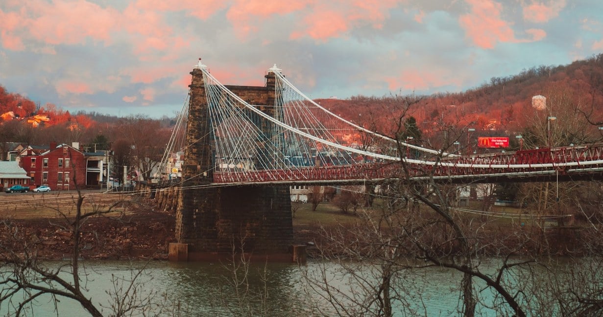 The Wheeling Suspension Bridge over the Ohio River at dusk in Wheeling, West Virginia