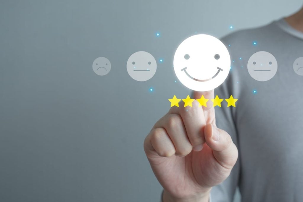 Hand touch on happy smiling face with 5 star. Positive emotion, Enjoy, World mental health day, Mental health assessment, Customer experience and service review, Satisfaction, Feedback rating.
