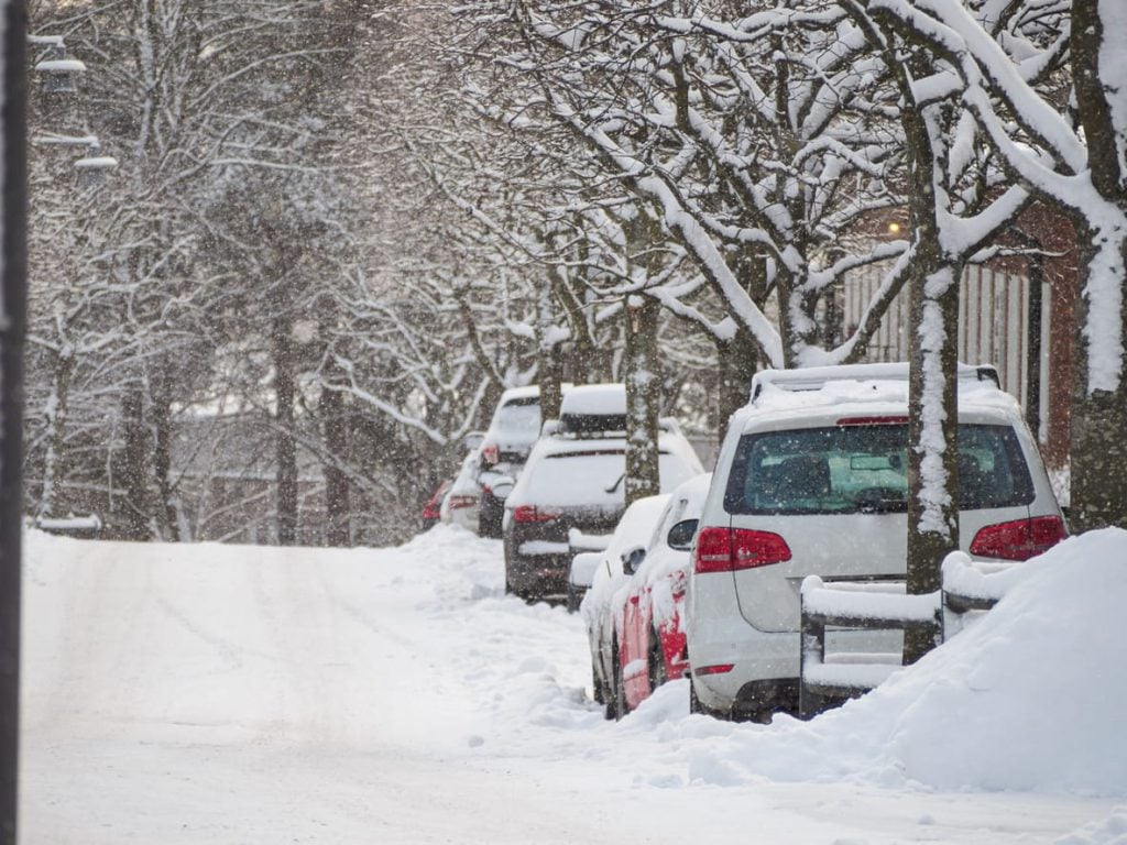Cars parked on a snowy street