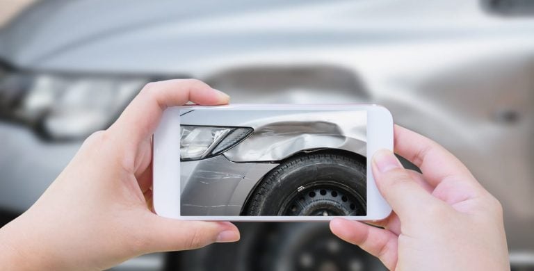 woman using mobile smartphone take photo car crash accident