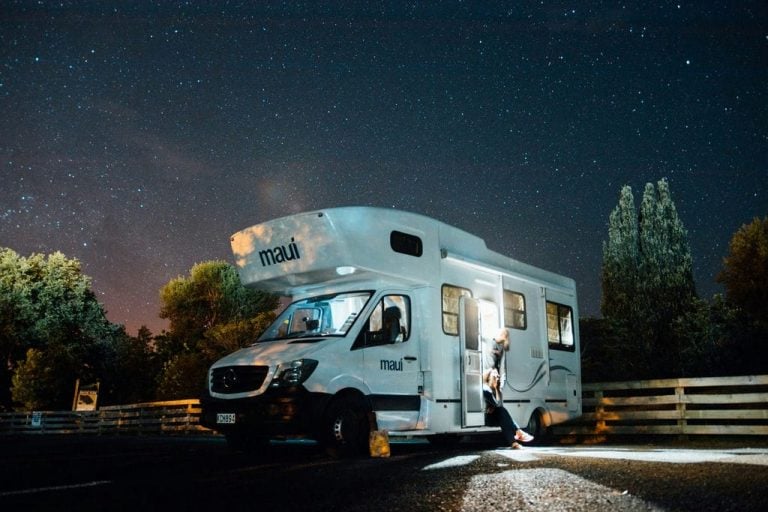 Motorhome parked under a night sky full of stars