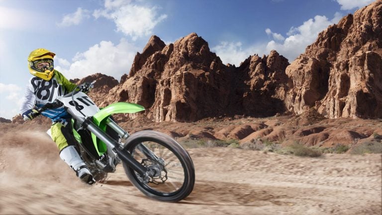 Professional dirt bike rider racing on the desert