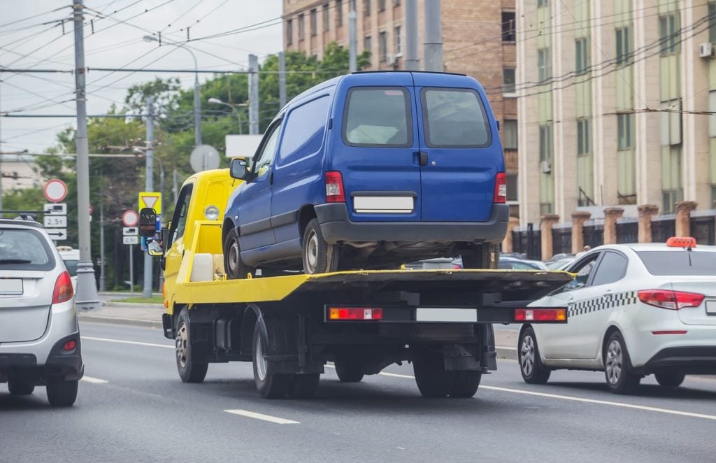 truck transporting a car