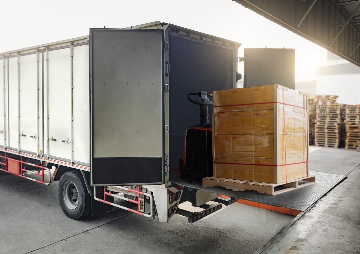 Cargo Truck Container Loading Packaging Boxes at Dock Warehouse.