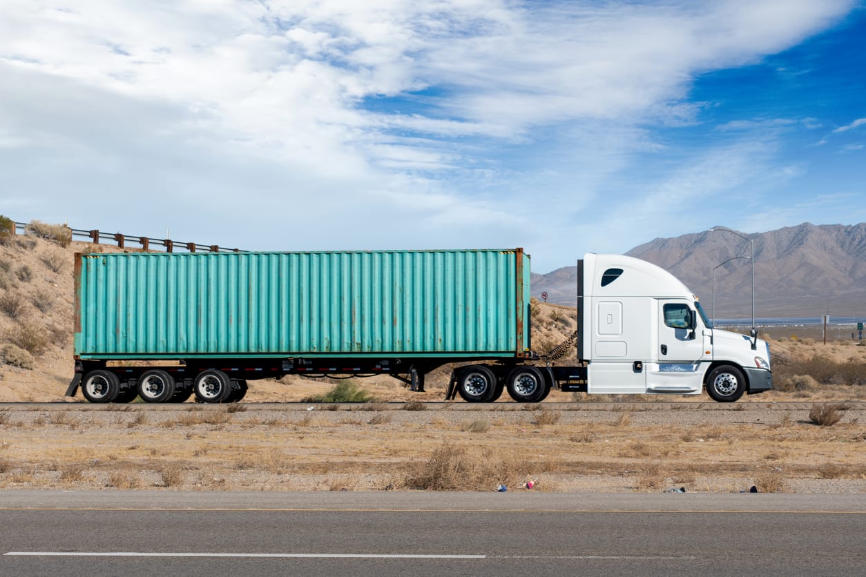 Getting Your Container off a Flatbed or Step-Deck Truck