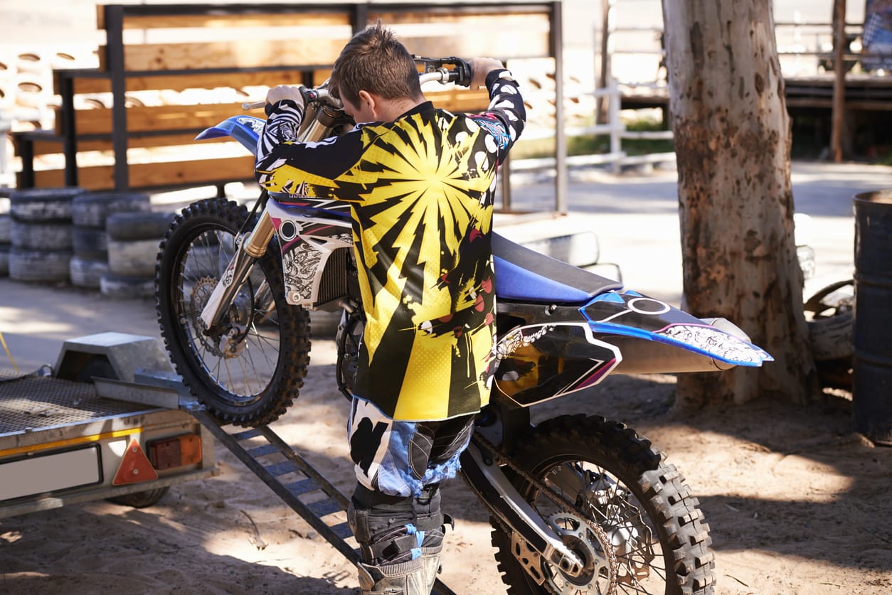 Load the motorcycle onto the shipping container