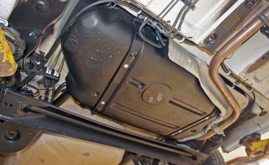 What is the Reason that Gas Tanks are not Located on the Same Side in all Cars