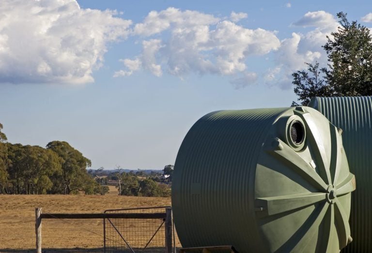 Large storage tank standing in a rural field