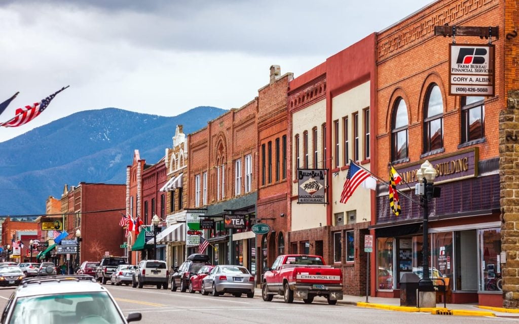 Main street of a small American town with mountains behind