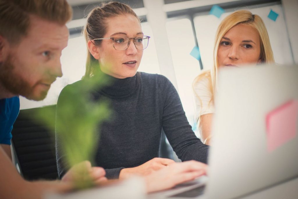 People talking around a table in an office