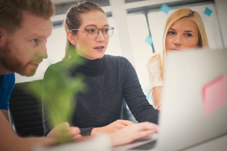 People talking around a table in an office