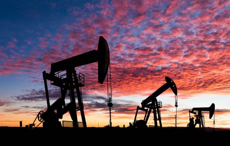 Oil pumpjacks silhouetted at sunset