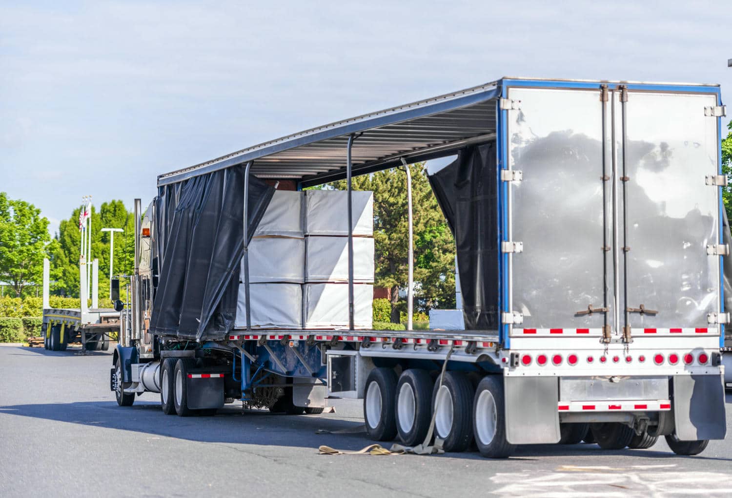 The Best Vehicle Transport. Luxury car inside an enclosed transport trailer, highlighting protection during shipping