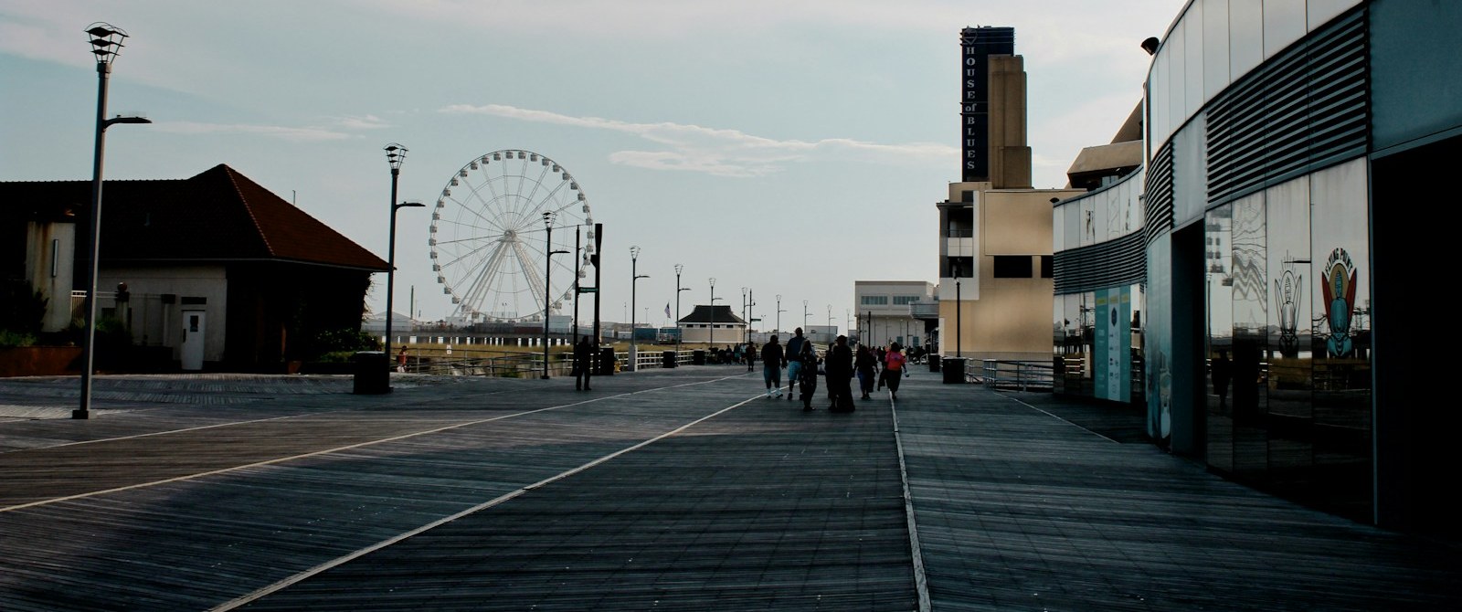 The Atlantic City Boardwalk on a quiet summer morning with the observation wheel in the distance
