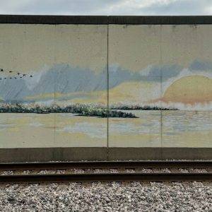 Painted floodwall mural along the railroad tracks in downtown Cape Girardeau, Missouri