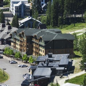 Lodges and parking of the Whitefish Mountain Resort village in summer