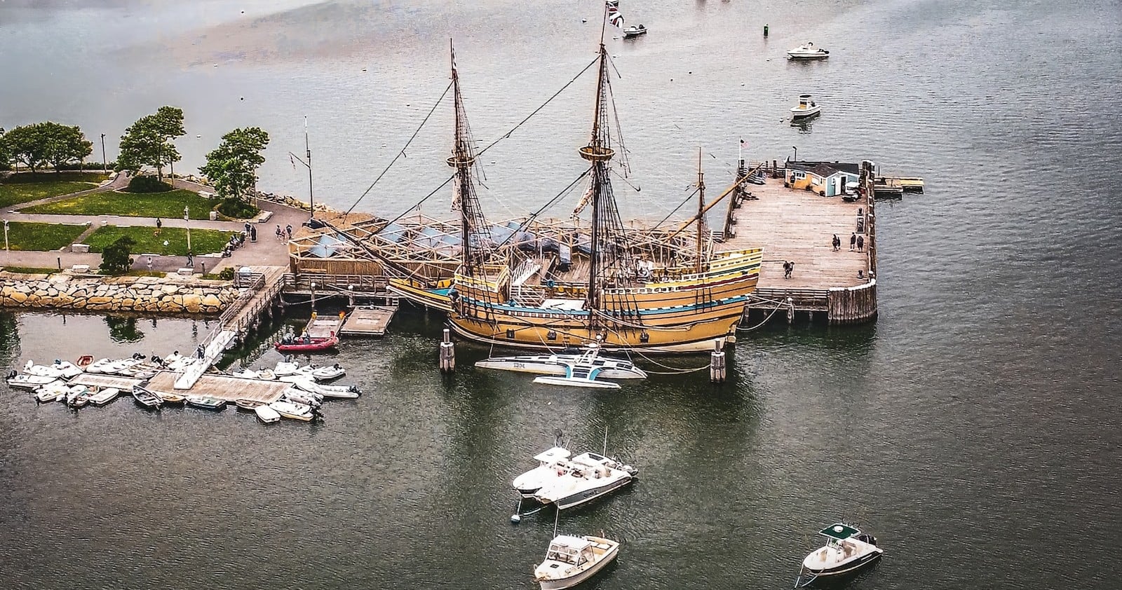 A tall ship docked at the State Pier on Plymouth Harbor in Plymouth, Massachusetts
