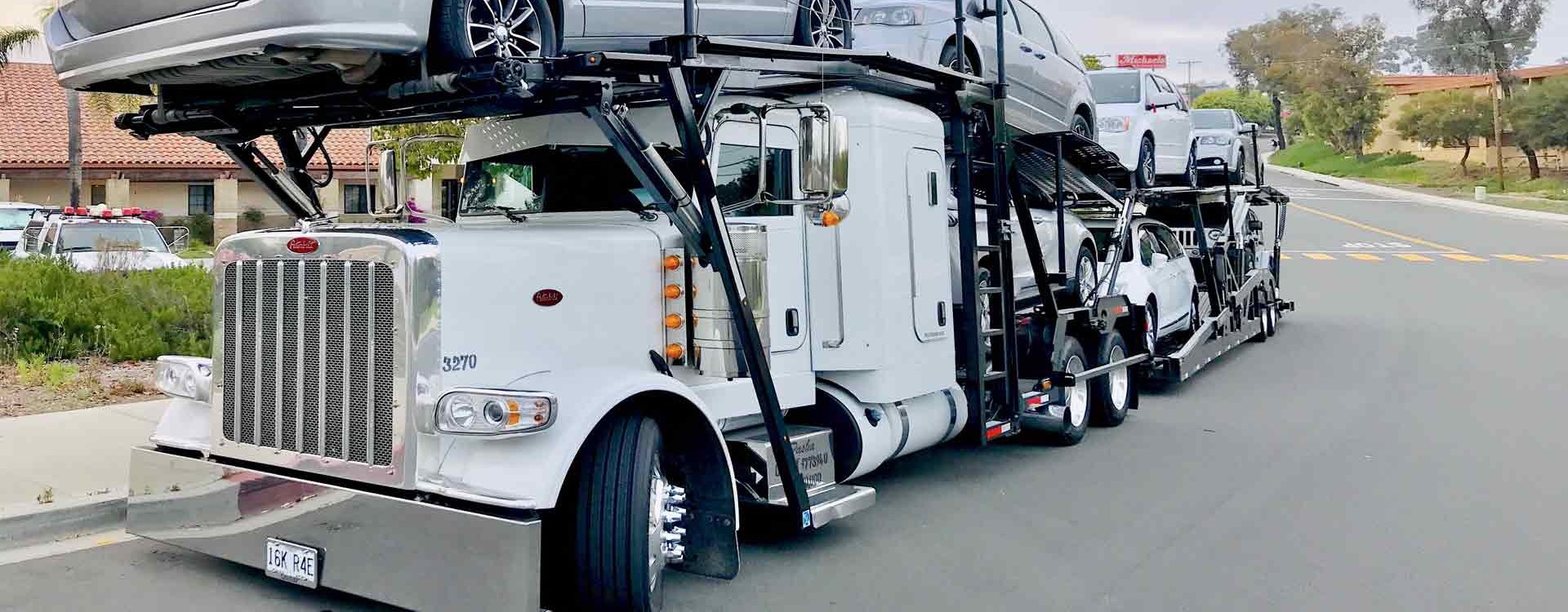 White semi car hauler loaded on the road