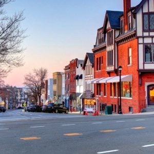 Historic buildings along Greenwich Avenue in downtown Greenwich, Connecticut at dusk