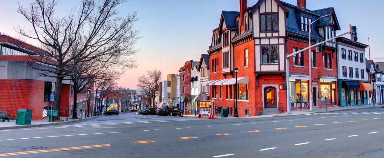 Historic buildings along Greenwich Avenue in downtown Greenwich, Connecticut at dusk