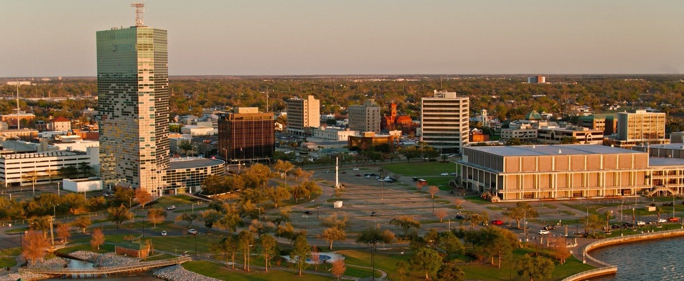 Aerial view of the Lake Charles, Louisiana lakefront and downtown at golden hour