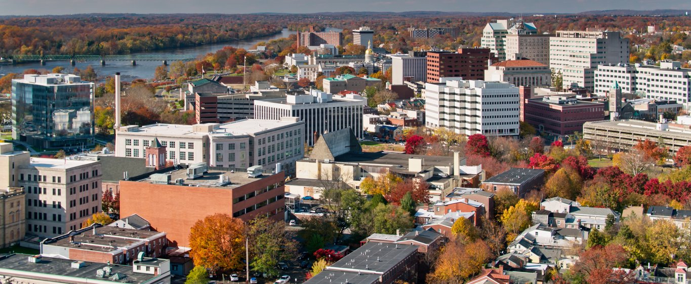 Aerial view of downtown Trenton, New Jersey with the State House dome and Delaware River in autumn