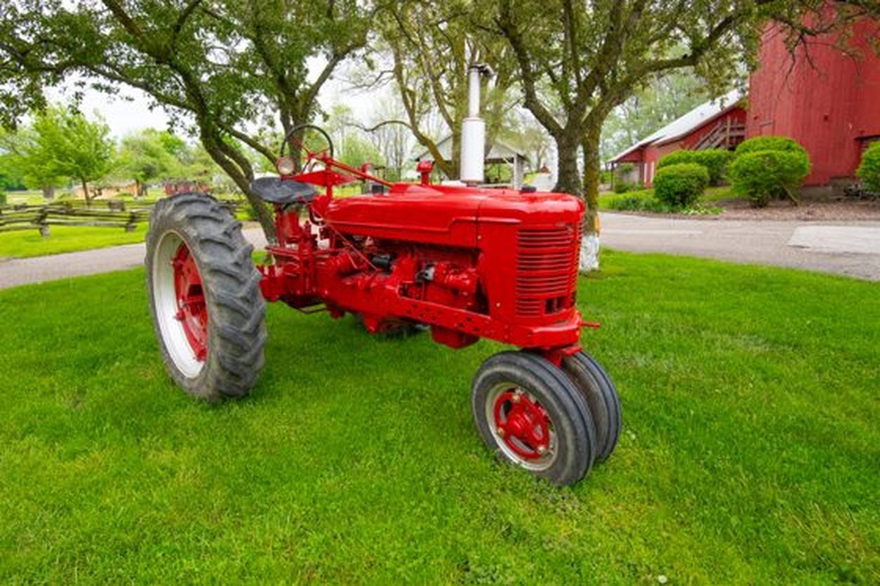 Vintage red Farmall tractor parked on an Indiana farm