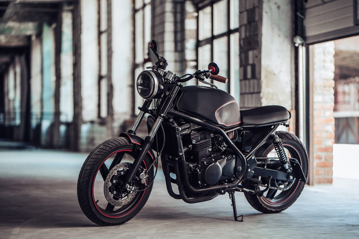 Blacked out custom motorcycle in an industrial building