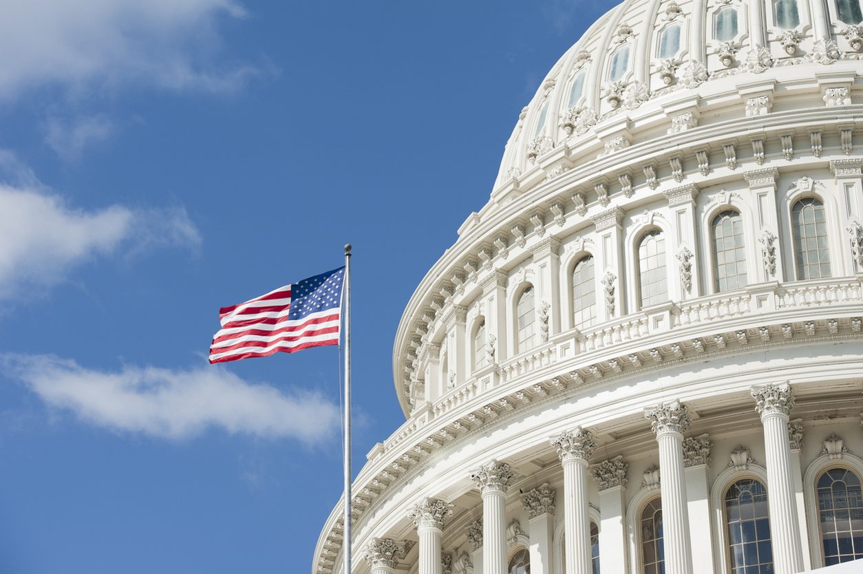 American flag in front of the Capitol dome