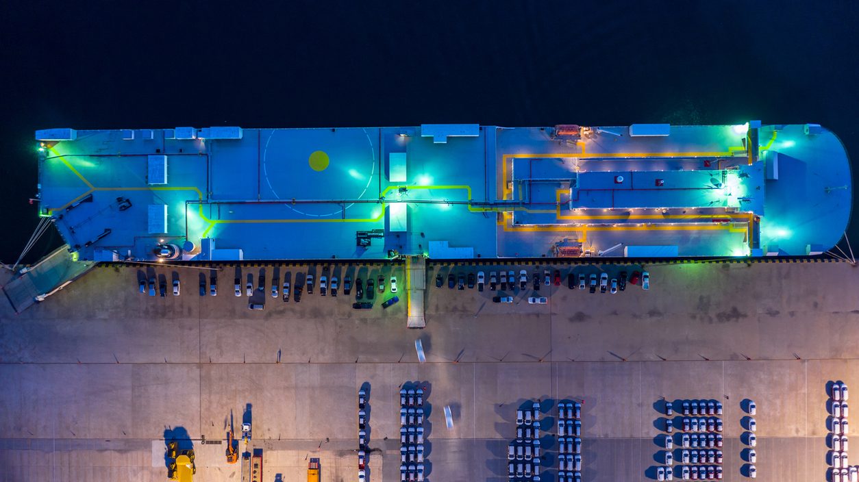 Vehicle carrier vessel loading at a terminal at night