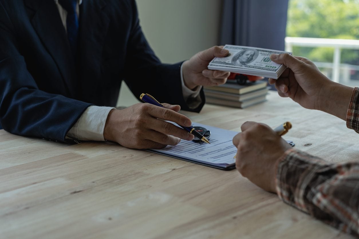 Money changing hands over a contract