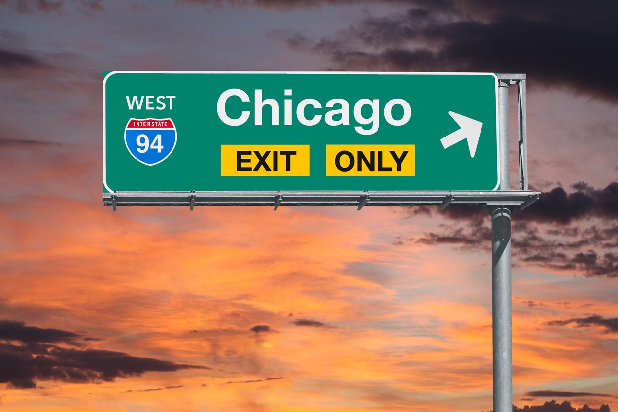 Interstate 94 west exit sign for Chicago at sunset