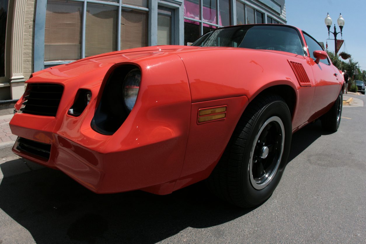 Classic American muscle car parked on a street