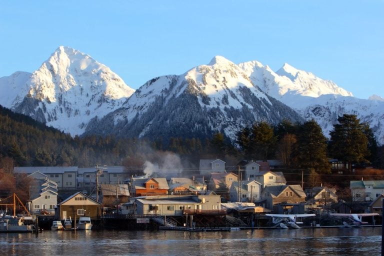Southeast Alaska waterfront town below snow capped peaks