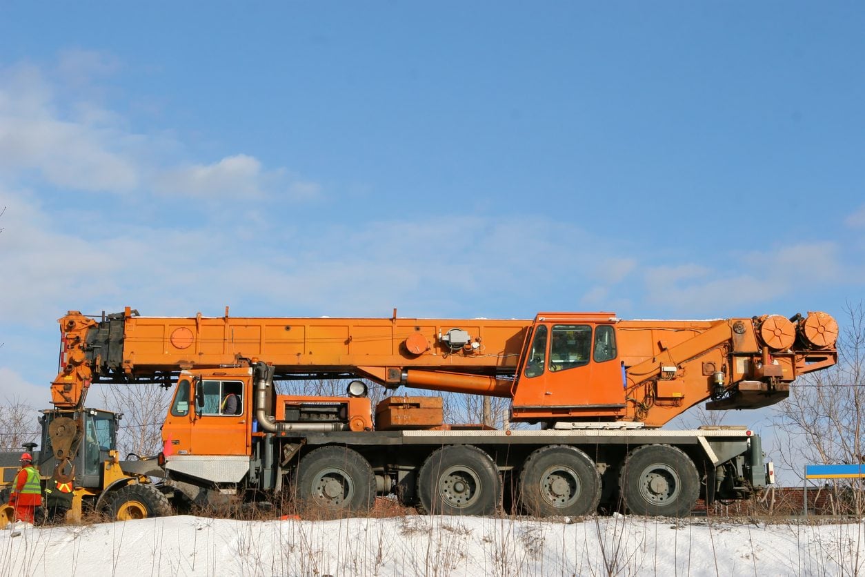 Multi axle mobile crane carrier on a work site