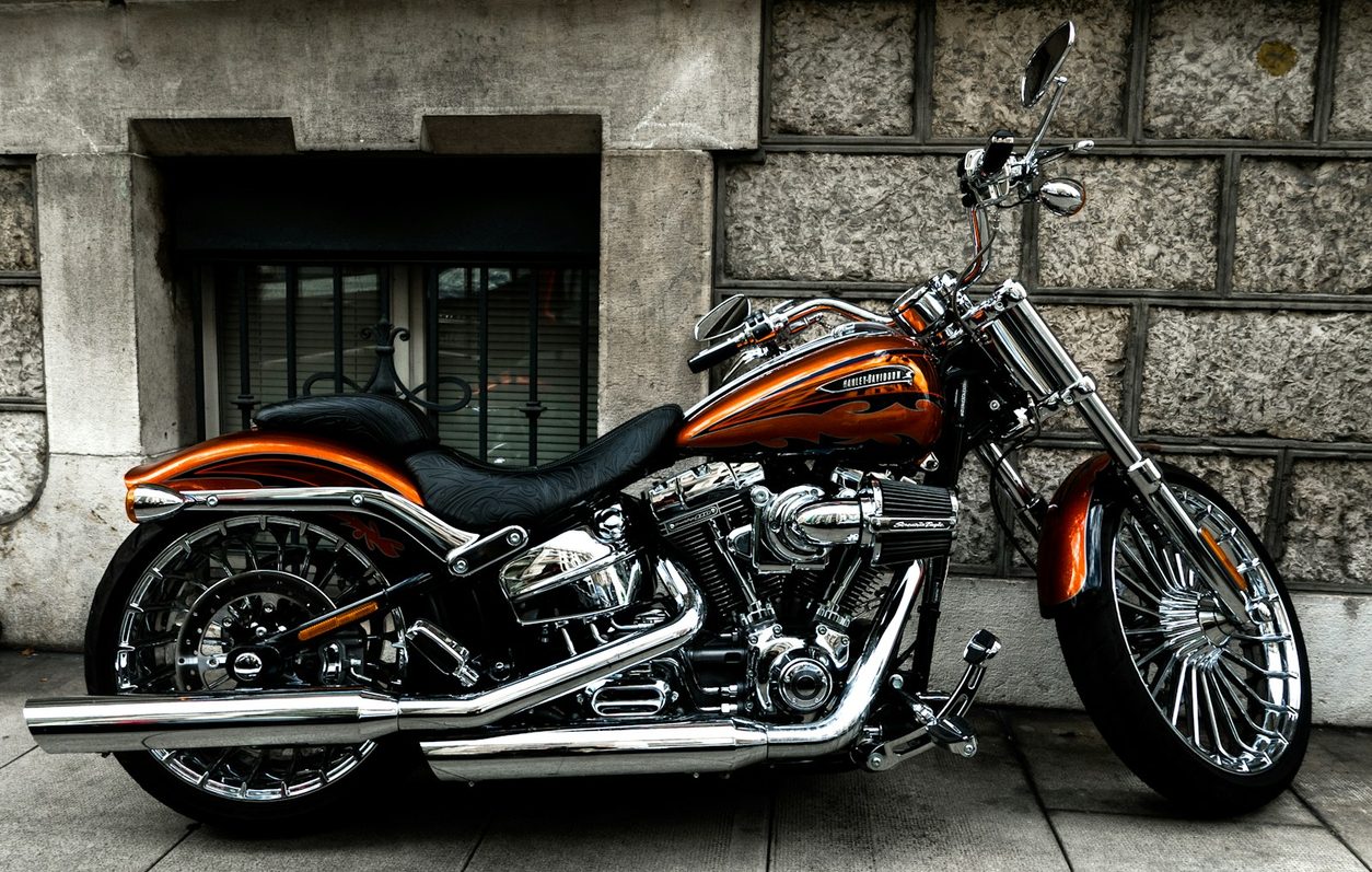 Black Harley-Davidson cruiser parked on a city street