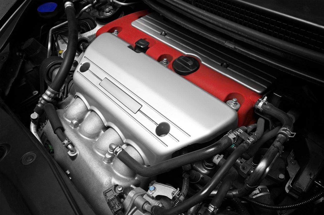 Engine seated in the engine bay of a car