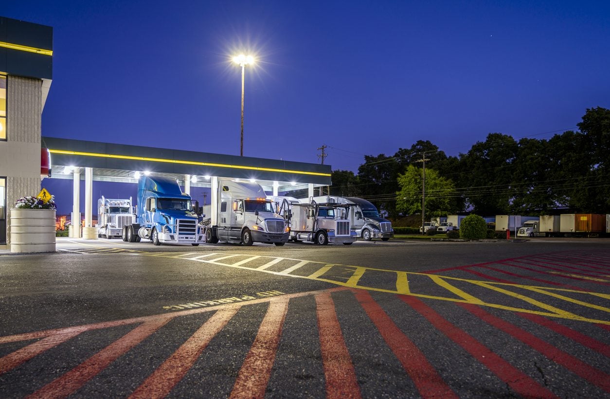 Trucks staged at a yard before departing westbound