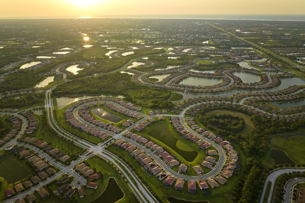 Aerial view of a gated community with winding private streets