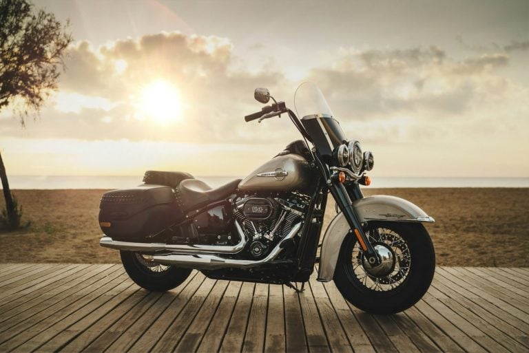 Harley-Davidson touring motorcycle parked at sunset
