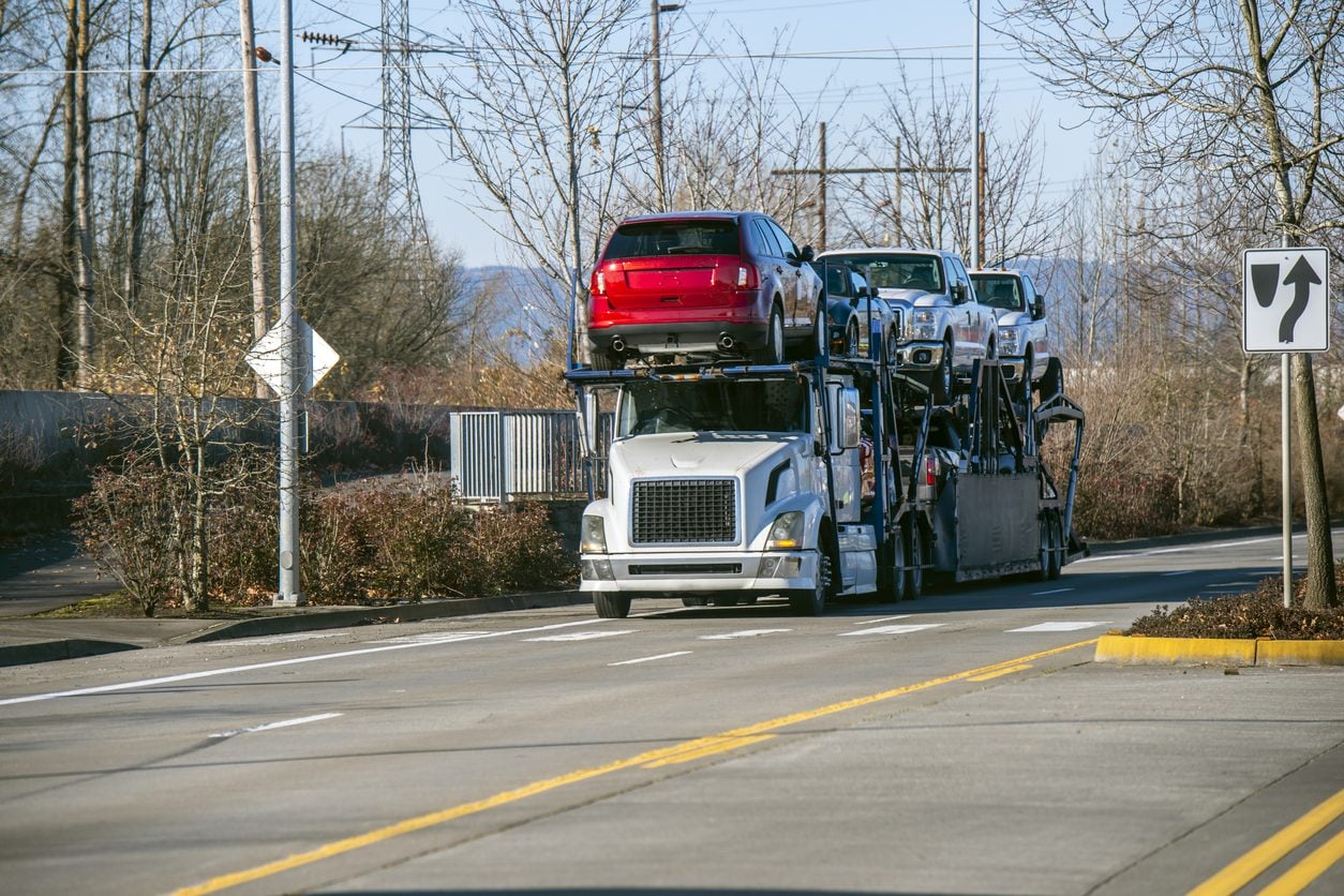 Fully loaded car hauler running a divided highway