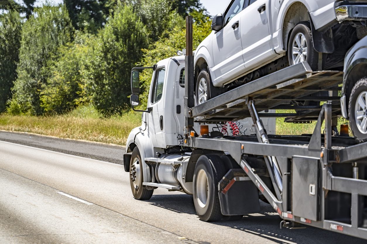 Day cab car hauler loaded with crossovers
