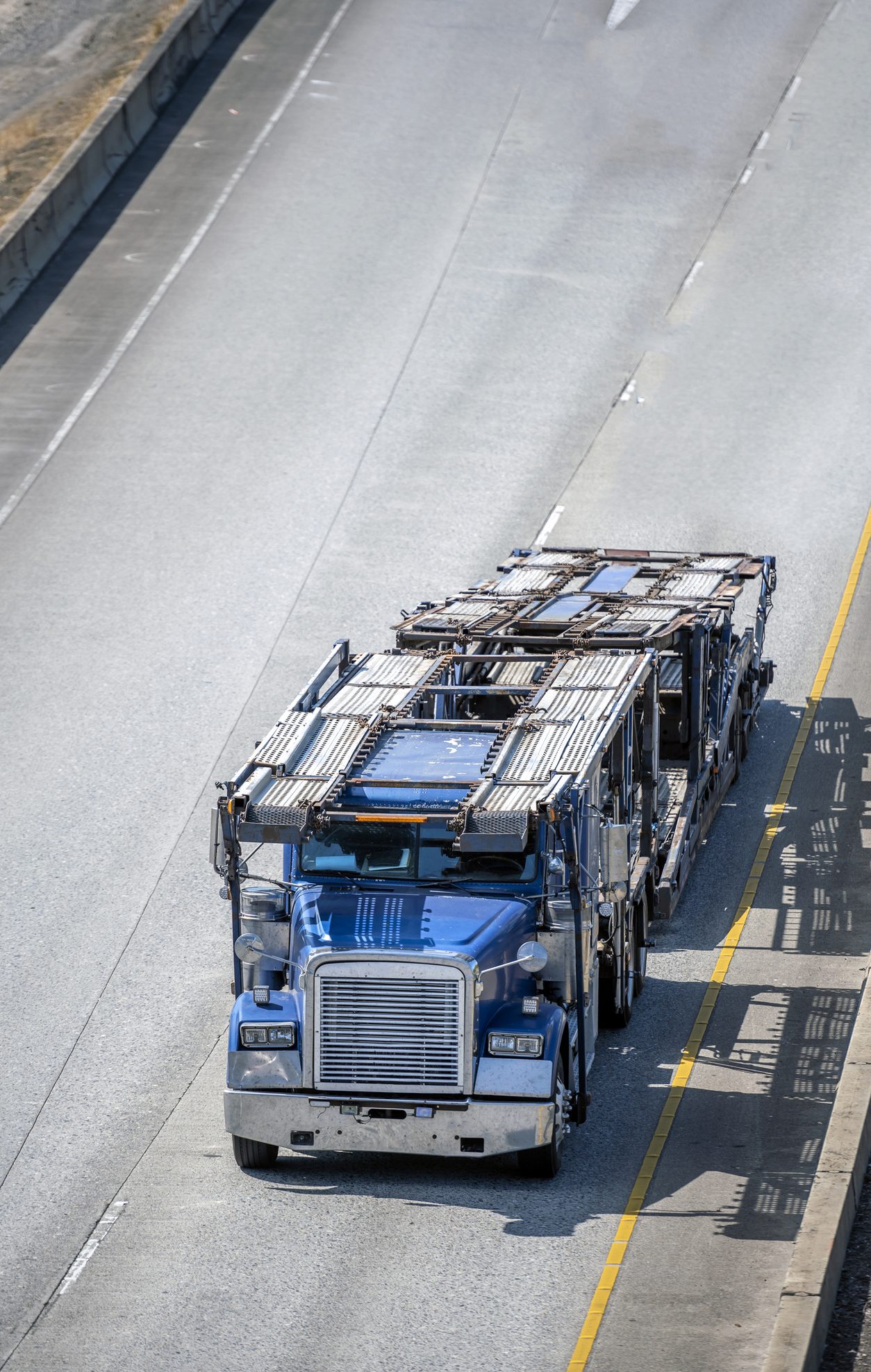 Empty car hauler running toward a loading point
