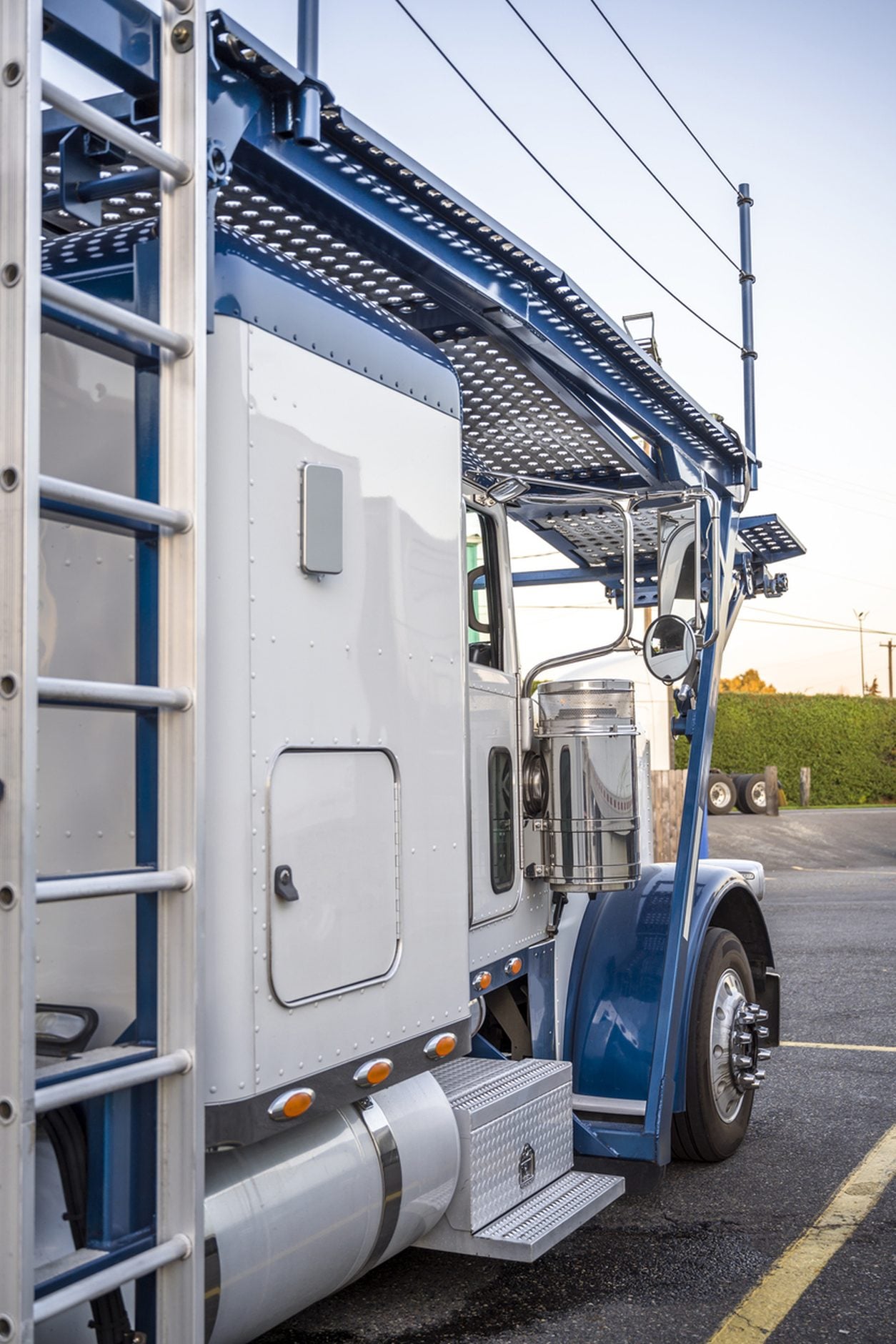 Two level car hauler trailer parked at a truck stop