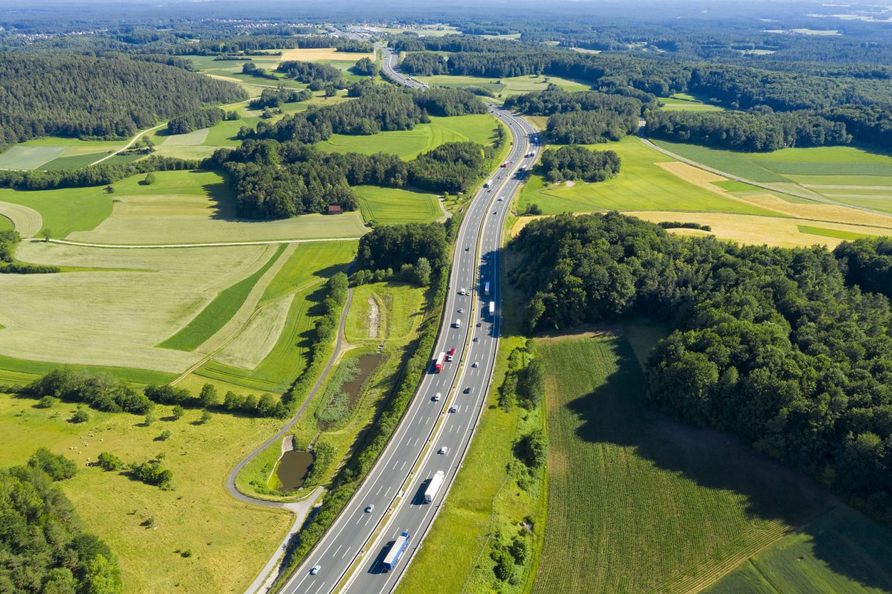 Aerial view of a highway through farmland