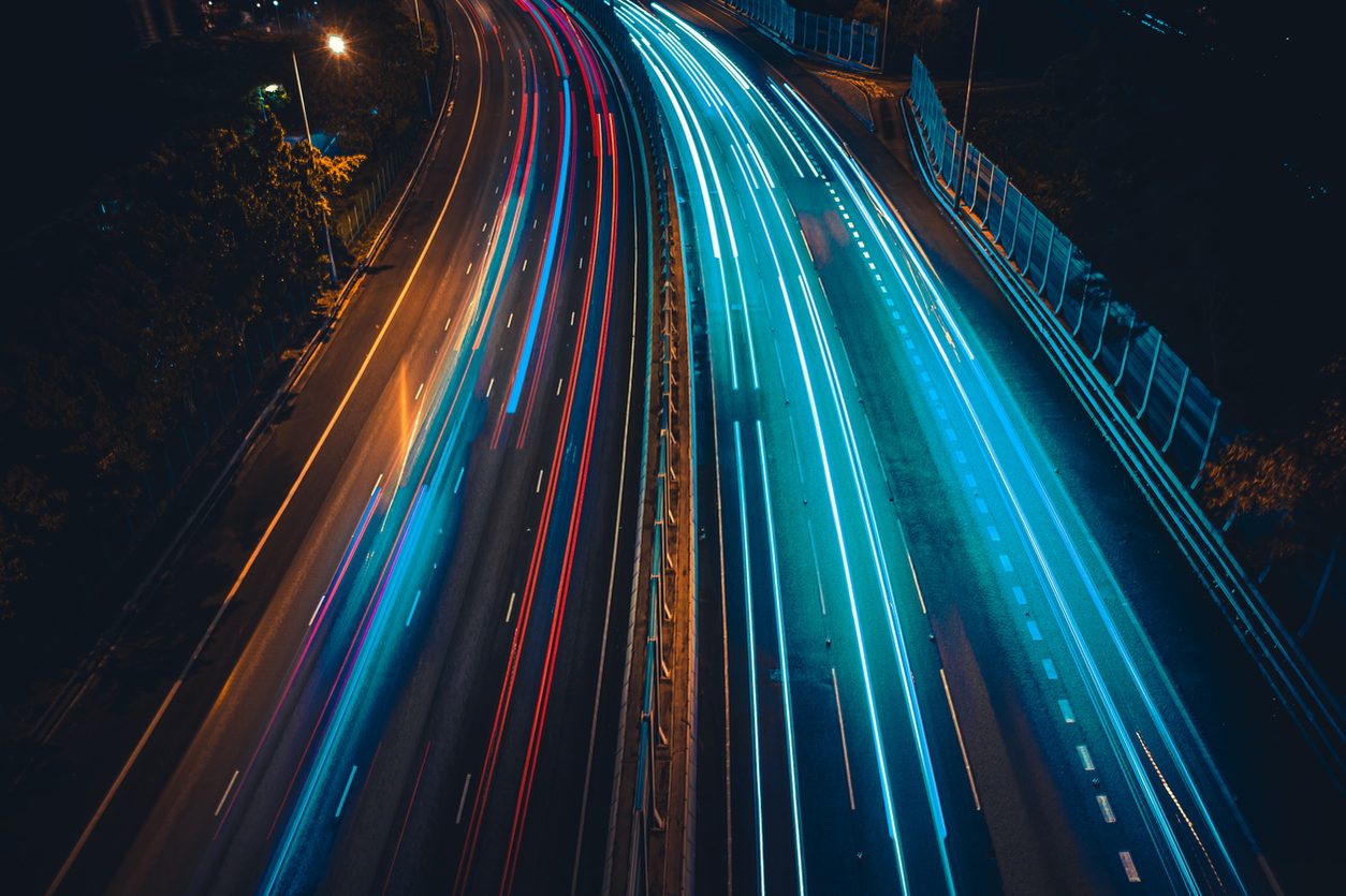Light trails from traffic on a highway at night
