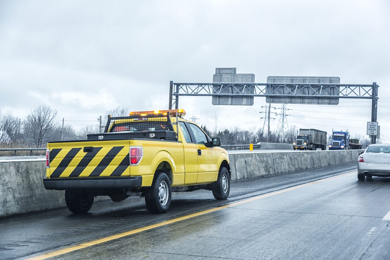 Highway incident response pickup on an expressway shoulder